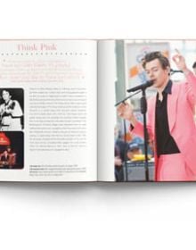 Book cover of Terry Newman's fashion guide, Harry Styles and the clothes he wears, with the singer posing in black leather look suit, beige fur boa, with floral backdrop. Published by ACC Art Books.