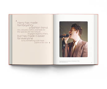 Book cover of Terry Newman's fashion guide, Harry Styles and the clothes he wears, with the singer posing in black leather look suit, beige fur boa, with floral backdrop. Published by ACC Art Books.