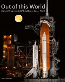 The illuminated Space Shuttle Endeavour STS-134 on launch pad, in 2011, under black sky with bright full moon, on cover of 'Out of This World', by ACC Art Books.