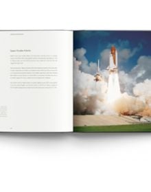 Book cover of Out of This World: Historic Milestones in NASA’s Human Space Flight, featuring the illuminated Space Shuttle Endeavour STS-134 on launch pad, in 2011, under black sky with bright full moon. Published by ACC Art Books.
