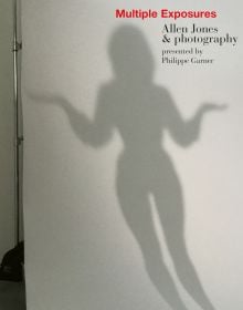 Silhouette of female figure illuminated on wall, on cover of 'Multiple Exposures Allen Jones & Photography', by ACC Art Books.