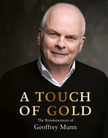 Antiques Roadshow presenter Geoffrey Munn in black sweater, smiling at the camera, on cover of 'A Touch of Gold', by ACC Art Books.