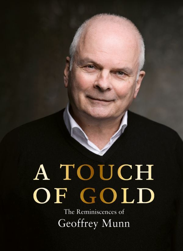 Book cover of A Touch of Gold, with Antiques Roadshow presenter Geoffrey Munn in black sweater, smiling at the camera. Published by ACC Art Books.