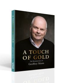 Book cover of A Touch of Gold, with Antiques Roadshow presenter Geoffrey Munn in black sweater, smiling at the camera. Published by ACC Art Books.