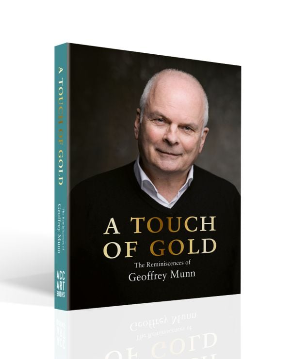 Book cover of A Touch of Gold, with Antiques Roadshow presenter Geoffrey Munn in black sweater, smiling at the camera. Published by ACC Art Books.