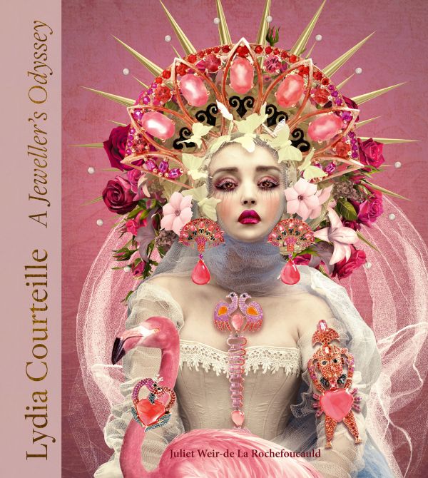 Book cover of Lydia Courteille, A Jeweller’s Odyssey, with a porcelain skinned female model adorned with bold pink jewelled earrings and brooches. Published by ACC Art Books.