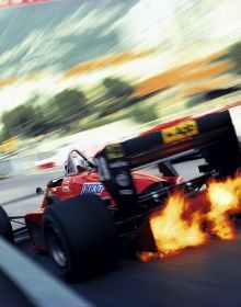 F1 legend Michael Schumacher in red Ferrari, racing round corner of track, on cover of 'Ferrari, From Inside and Outside', by ACC Art Books.