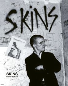 Book cover of Skins, featuring a young white male skinhead in black jacket, with his arms folded, looking to his left, and 'SKINS', in black graffiti on wall behind. Published ACC Art Books.