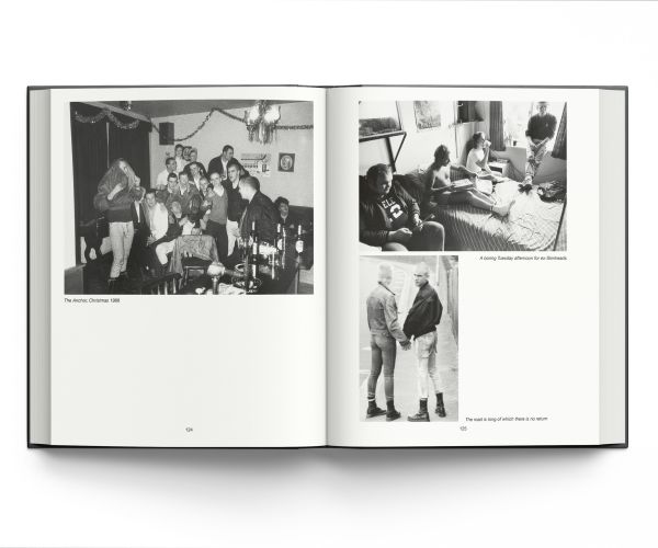 Book cover of Skins, featuring a young white male skinhead in black jacket, with his arms folded, looking to his left, and 'SKINS', in black graffiti on wall behind. Published ACC Art Books.