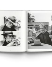 Book cover of David Bowie: Rock ’n’ Roll with Me, featuring David Bowie posing in white t-shirt with arms above head. Published by ACC Art Books.