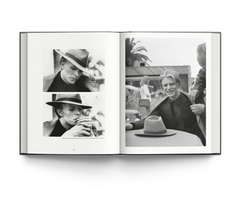 Book cover of David Bowie: Rock ’n’ Roll with Me, featuring David Bowie posing in white t-shirt with arms above head. Published by ACC Art Books.