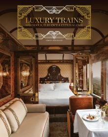 The luxurious Budapest Grand Suite on the Venice Simplon - Orient-Express, carved wood headboard, on cover of 'Luxury Trains', by ACC Art Books.