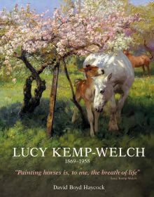 Book cover of Lucy Kemp-Welch 1869-1958, featuring a painting of white horse and brown foal standing in a field, beneath a pink blossom tree. Published by ACC Art Books.