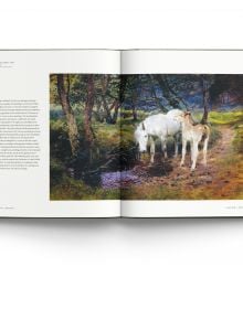 Book cover of Lucy Kemp-Welch 1869-1958, featuring a painting of white horse and brown foal standing in a field, beneath a pink blossom tree. Published by ACC Art Books.