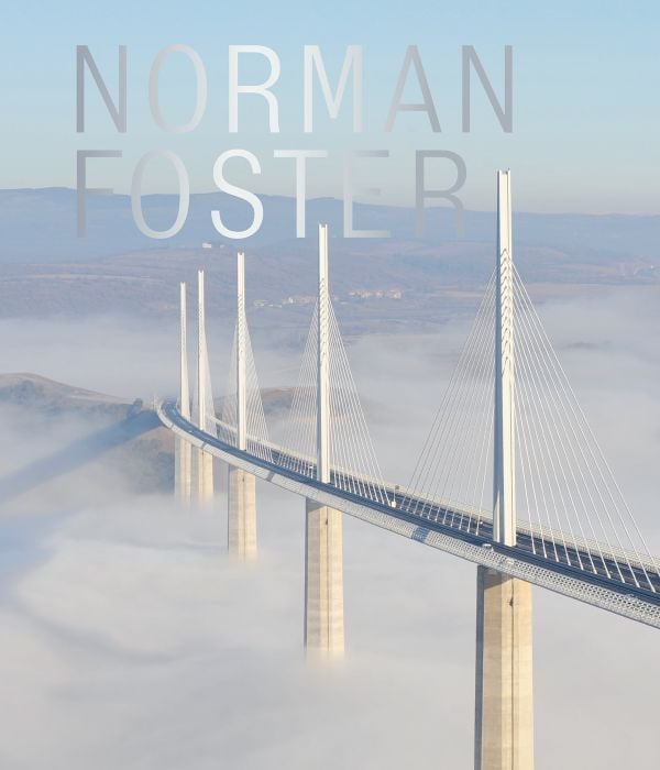 Book cover of Norman Foster', featuring one of the world's tallest bridges, the Millau Viaduct in France surrounded by low cloud. Published by ACC Art Books.