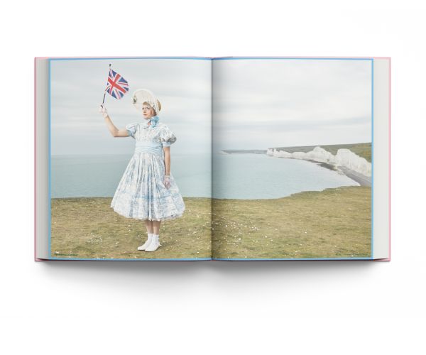 Book cover of MUSE, A Portrait of Grayson Perry, with a figure, coin and cake. Published by Lannoo Publishers.