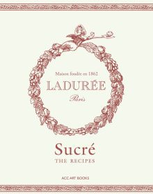 Box cover of 'Ladurée Sucré , The Recipes, with a ring of acorns and leaves. Published by ACC Art Books.