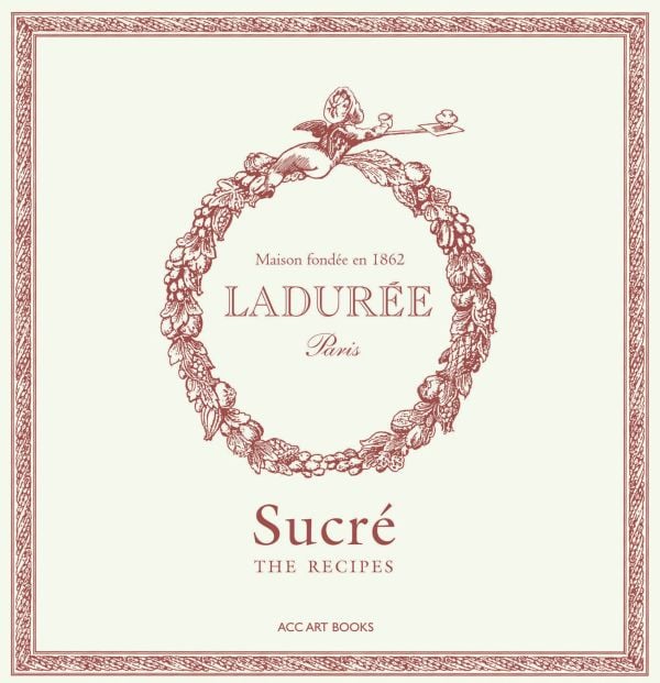Box cover of 'Ladurée Sucré , The Recipes, with a ring of acorns and leaves. Published by ACC Art Books.