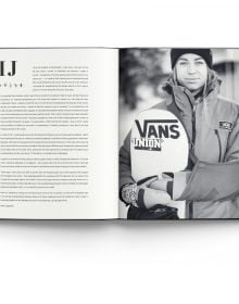Book cover of Heroes, Women in Snowboarding, with female snowboarder sliding down rail of steps covered in snow. Published by ACC Art Books.