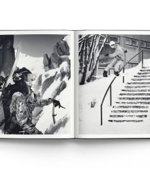 Book cover of Heroes, Women in Snowboarding, with female snowboarder sliding down rail of steps covered in snow. Published by ACC Art Books.