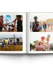 Book cover Liam Bailey's Glastonbury: The Festival and Its People, with festival goers standing at top of hill with tents behind them. Published by ACC Art Books.
