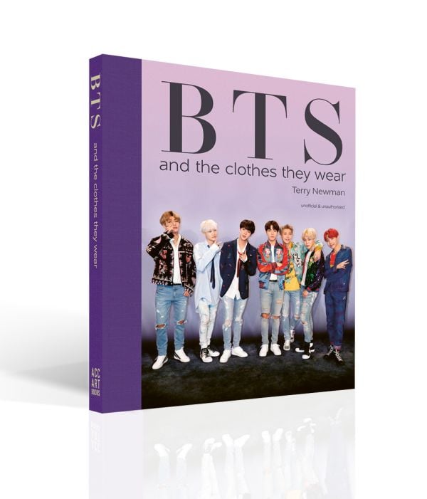 Book cover of BTS: And the Clothes They Wear, with all seven members of the band posing in ripped jeans and colourful jackets. Published by ACC Art Books.