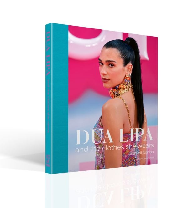 Book cover of Scarlett Conlon's Dua Lipa: And the Clothes She Wears, with the disco star posing in a floral Bottega Veneta dress at the Barbie premiere. Published by ACC Art Books.