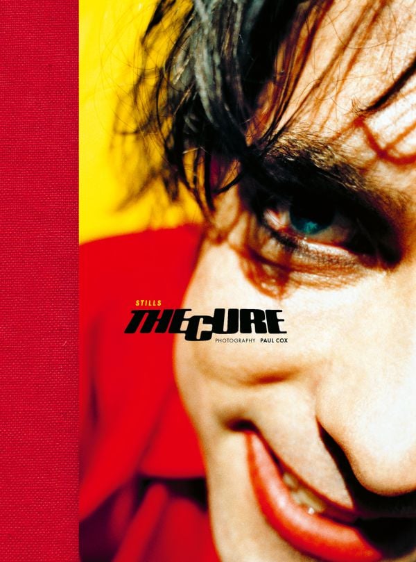 Book cover of The Cure: Stills, with a close up of front man Robert Smith in red lipstick. Published by ACC Art Books.