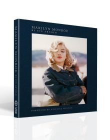Book cover of Marilyn Monroe: By Eve Arnold, with the actress wearing denim jacket as she strikes a pose on the set of 'The Misfits', 1960. Published by ACC Art Books.