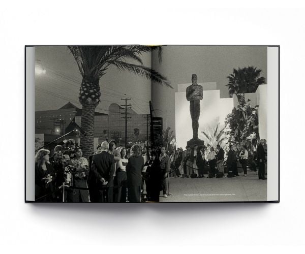 Book cover of Hollywood: Confidential, with a HBO news reporter talking to the camera. Published by ACC Art Books.