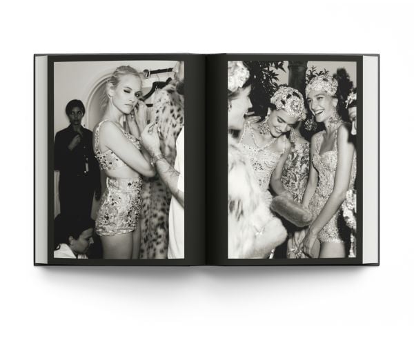 Book cover of La Dolce Vita: Inside the World of Dolce&Gabbana’s Alta Moda Fashion Shows, featuring a model in a large floral dress standing amongst a rocky mountain. Published by ACC Art Books.