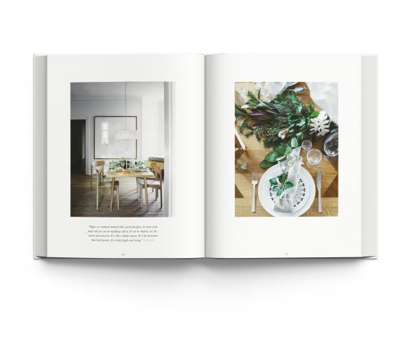 Book cover of The Christmas Season: Created by Scandinavian Artists; featuring an minimalist interior living room with a decorated Christmas tree. Published by ACC Art Books.