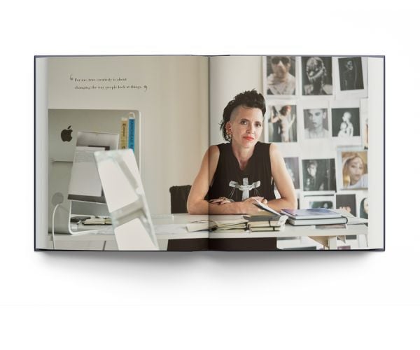 Book cover of Hannah Martin: Iconoclast; featuring the jeweler wearing safety pin earrings. Published by ACC Art Books.