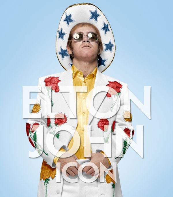 Book cover of Elton John: Icon; featuring the musician wearing a white suit and cowboy hat with blue stars. Published by ACC Art Books.