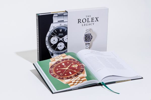 Book cover of The Rolex Legacy: The history of Rolex through 120 seminal and rare watches; featuring a silver Rolex watch. Published by ACC Art Books.