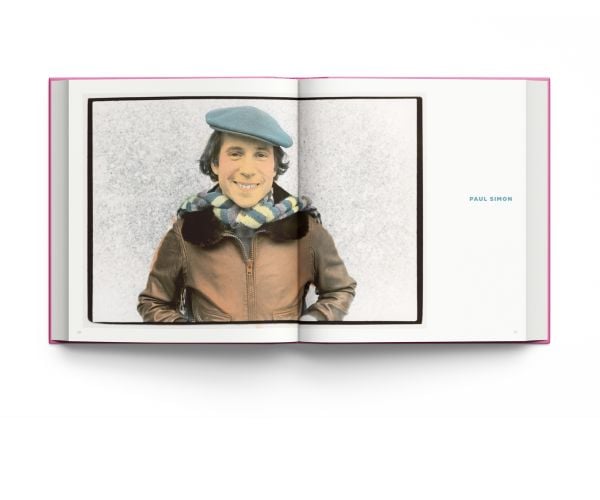 Book cover of Live From My Studio: The Art of Edie Baskin; featuring an artwork of Steve Martin wearing a suit, and holding a hat on finger on right hand. Published by ACC Art Books.