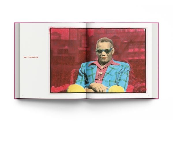 Book cover of Live From My Studio: The Art of Edie Baskin; featuring an artwork of Steve Martin wearing a suit, and holding a hat on finger on right hand. Published by ACC Art Books.