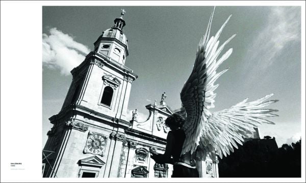 Book cover of Grace and Fire, featuring a model waving a fan while she leans backwards over a wall . Published by Kulturalis.