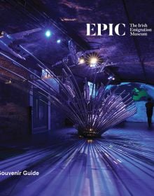 Book cover of EPIC The Irish Emigration Museum: Ireland Never Leaves You; showcasing a striking installation of illuminated metal rods radiating from a purple lit gallery. Published by Kulturalis.