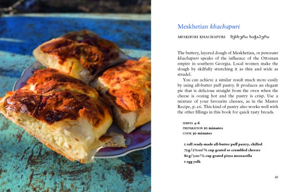 Two plates of food filled breads, 'Georgian Khachapuri and Filled Breads', in cream font below, by Pallas Athene.