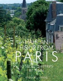 Vineyard with French commune behind, on travel guide cover of 'Half an Hour from Paris, 12 Secret Daytrips by Train', by Pallas Athene.