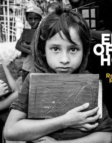 Landscape book cover of Edge of Hope, The Rohingya Refugee Camp at Cox's Bazar, featuring a group of children holding books, staring at viewer. Published by Pallas Athene.