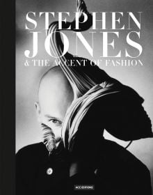 British milliner Stephen Jones wearing flamboyant, ruched hat to side of head, on cover of 'Stephen Jones, And the Accent of Fashion', by ACC Art Books.