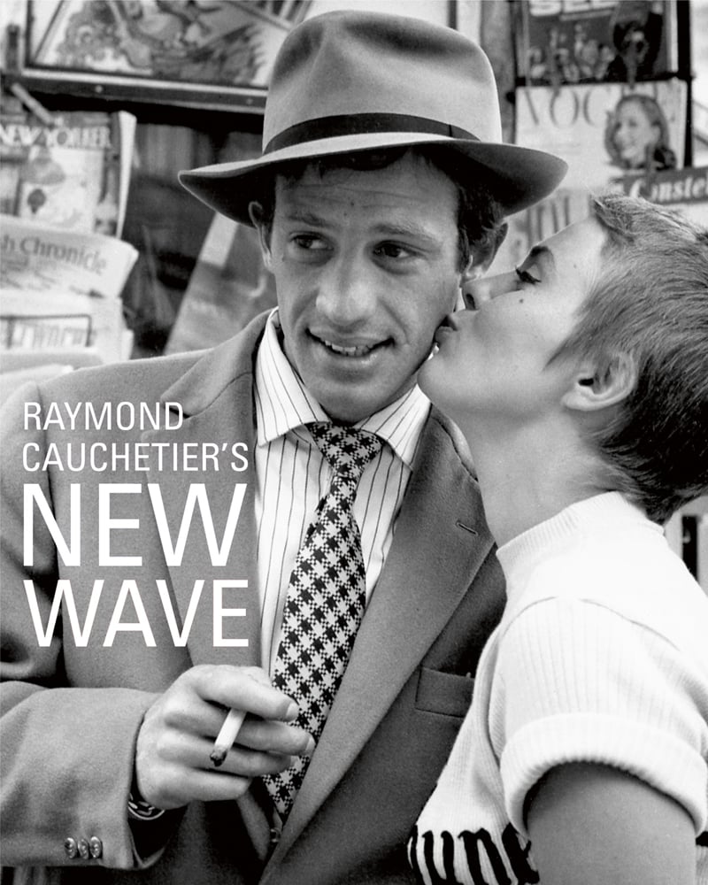 Book cover of Raymond Cauchetier's New Wave, featuring Jean Seberg kissing Jean Paul Belmondo's cheek on set from 1960 film 'Breathless'. Published by ACC Art Books.
