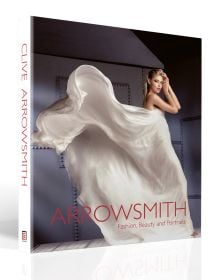 Book cover of Clive Arrowsmith: Fashion, Beauty & Portraits, featuring model Lisa Seffiert in billowing white Gucci dress. Published by ACC Art Books.