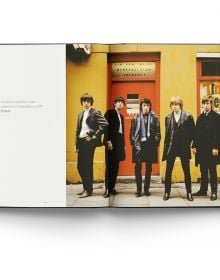 Book cover of Breaking Stones, featuring The Rolling Stones with Brian Jones, standing on city street. Published by ACC Art Books.