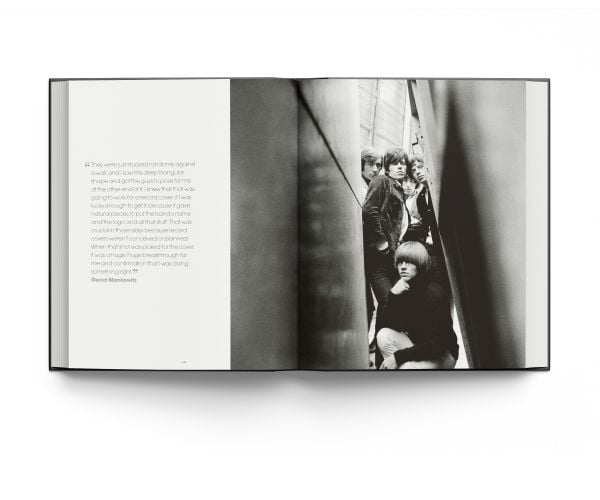 Book cover of Breaking Stones, featuring The Rolling Stones with Brian Jones, standing on city street. Published by ACC Art Books.