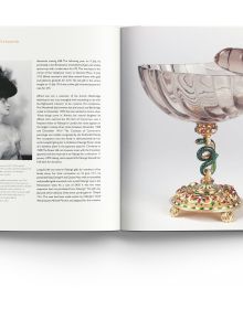 Green Faberge dish on gold stand with feet, on white cover of 'Faberge in London', by ACC Art Books.