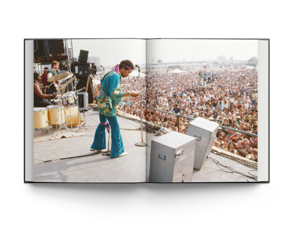 Book cover of Burning Desire: The Jimi Hendrix Experience Through the Lens of Ed Caraeff; featuring rock guitar legend Jimi Hendrix setting fire to his Fender Stratocaster. Published by ACC Art Books.