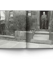 Book cover of Lowry: At Home, featuring the artist in his later years. Published by ACC Art Books.